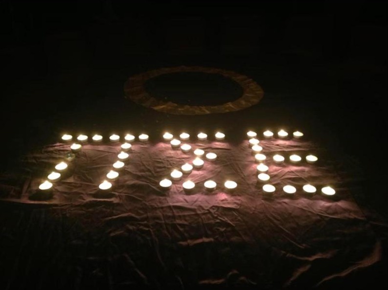 Candles arranged to spell PSE at a chapter ceremony